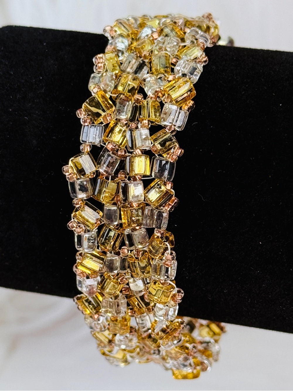 Pretty reflective Silvertone and Amber colored bracelet